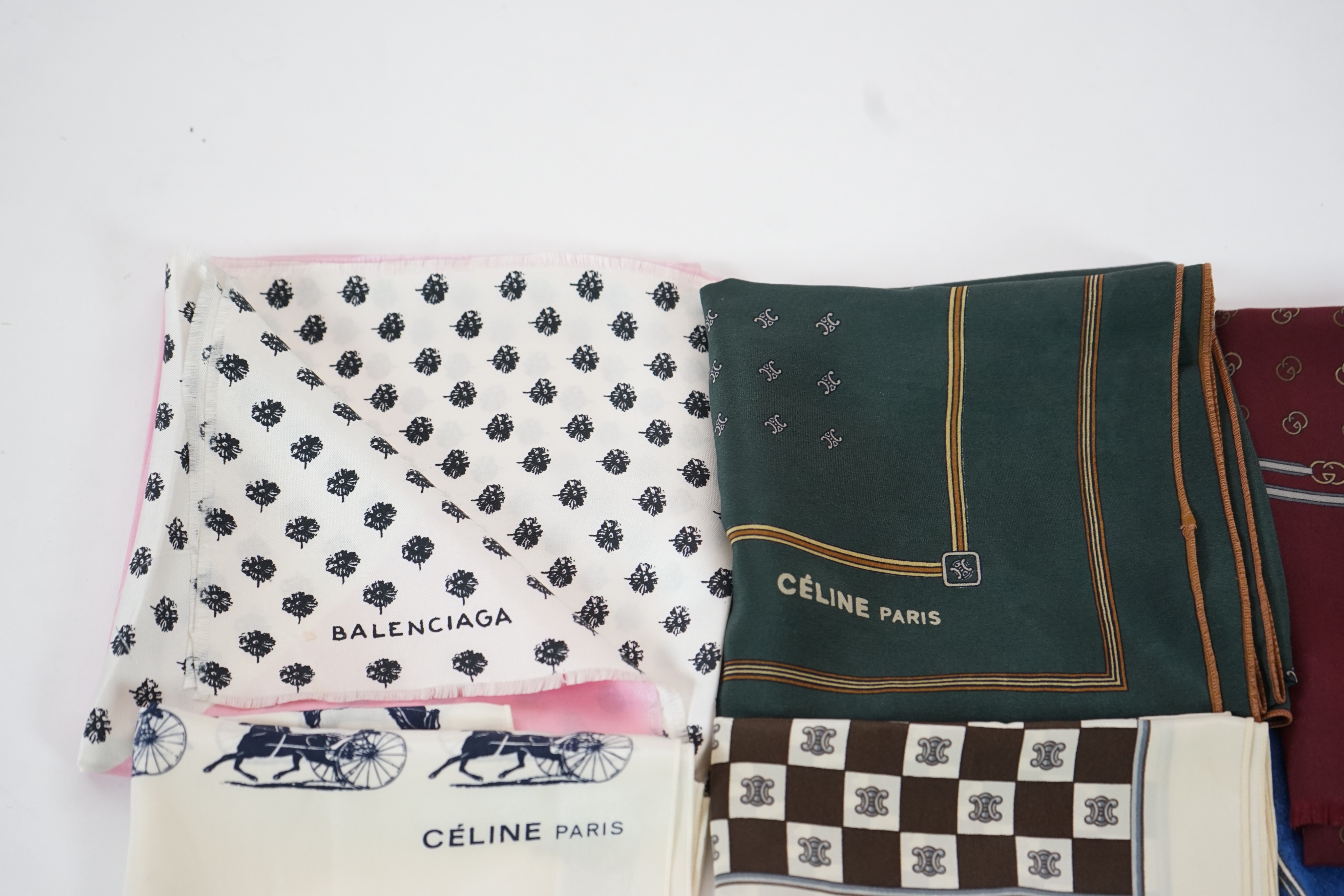 Three Gucci silk scarves, two by Celine and one by Balenciaga